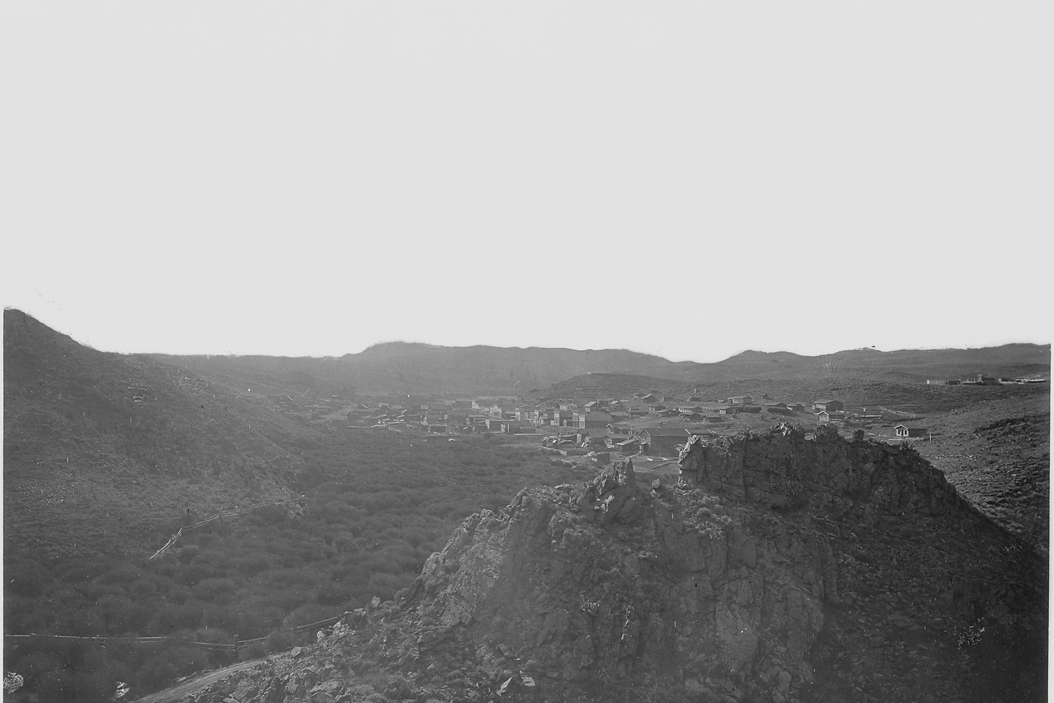 A nineteenth century view across the rocky sagebrush saddle of South Pass to a low ridge.